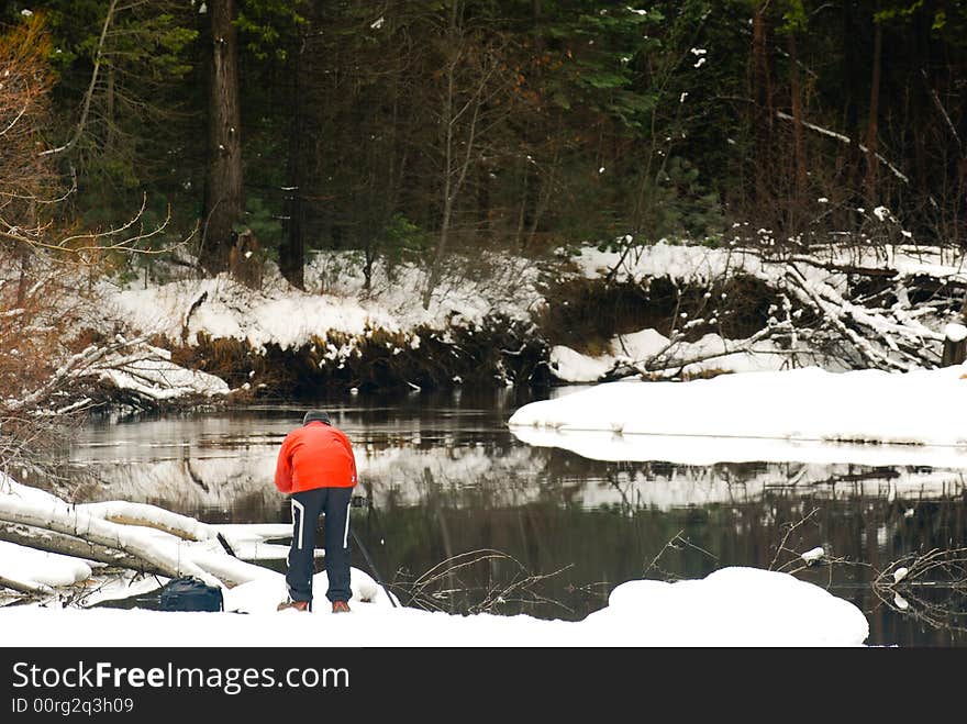 Photographer and frozen merced river