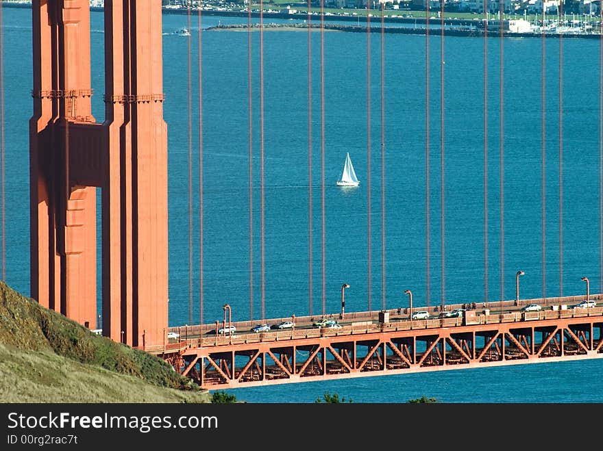 Sail boat in the pacific ocean in San Francisco bay framed by the golden gate bridge. Sail boat in the pacific ocean in San Francisco bay framed by the golden gate bridge.