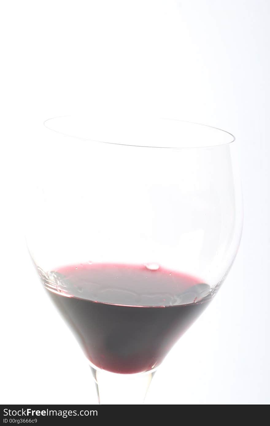 Red wine in a glas,on awithe background,.