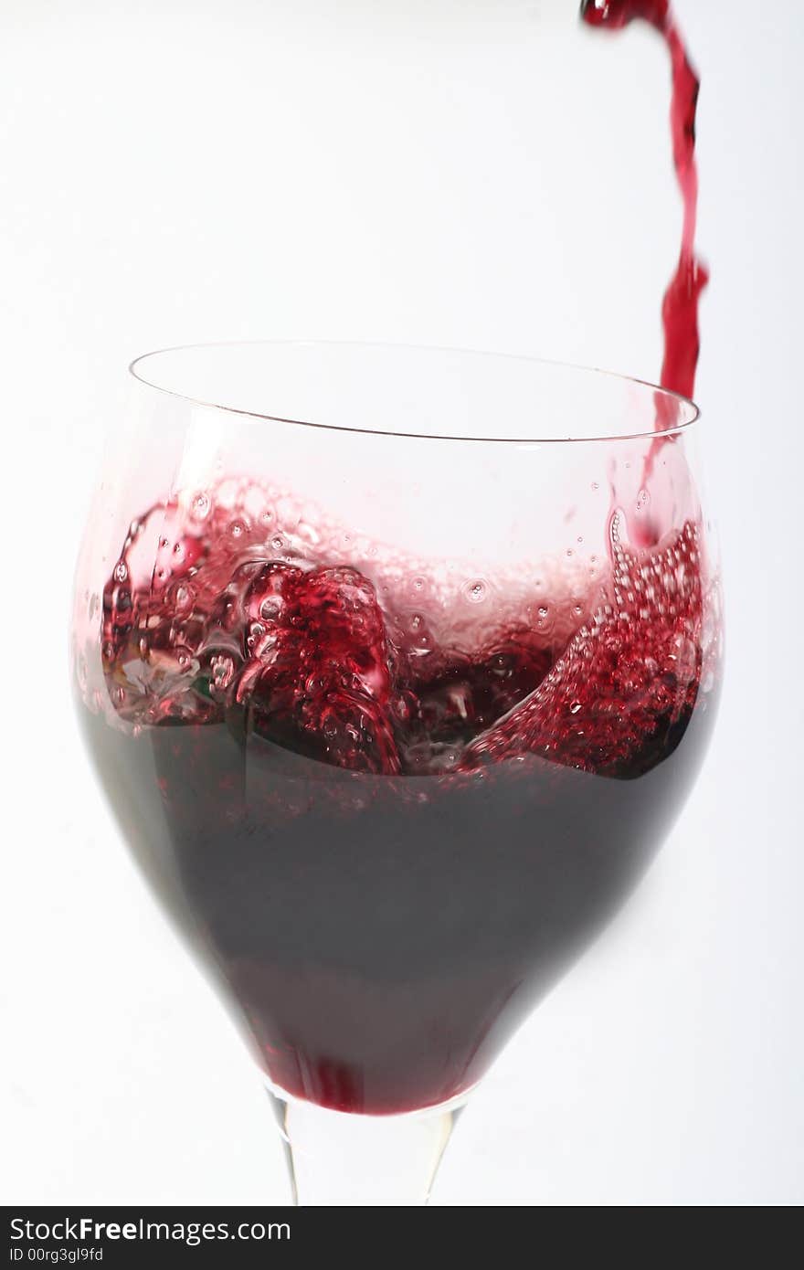 Red wine in a glas,on awithe background,.