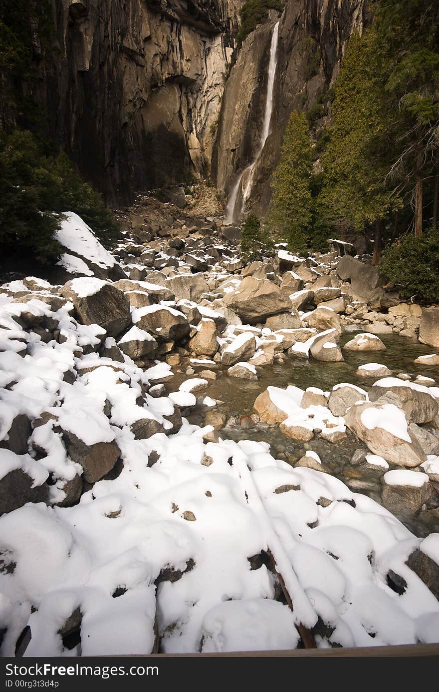 This is the lower yosemite falls with snow, in Yosemite National Park.
