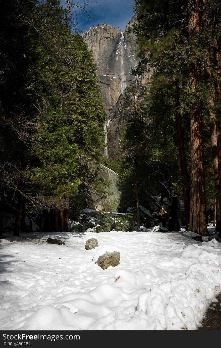 This is the lower yosemite falls with snow, in Yosemite National Park.