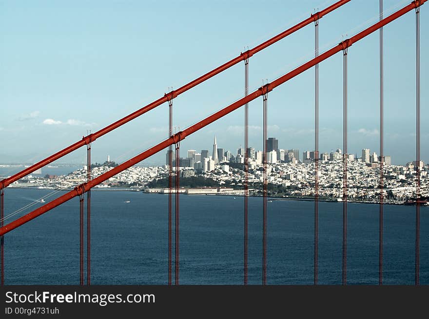 Sail boat in the pacific ocean in San Francisco bay framed by the golden gate bridge. Sail boat in the pacific ocean in San Francisco bay framed by the golden gate bridge.