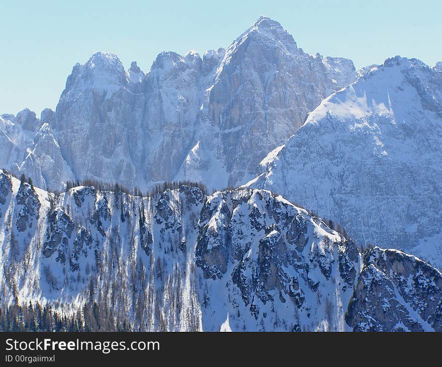 Beautiful snowy alpine peaks in winter. Beautiful snowy alpine peaks in winter