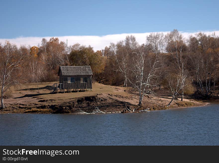 Frame house beside lake