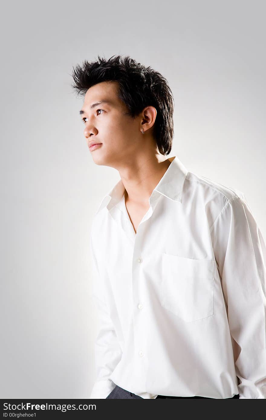 Young man look up thinking with white shirt. Young man look up thinking with white shirt