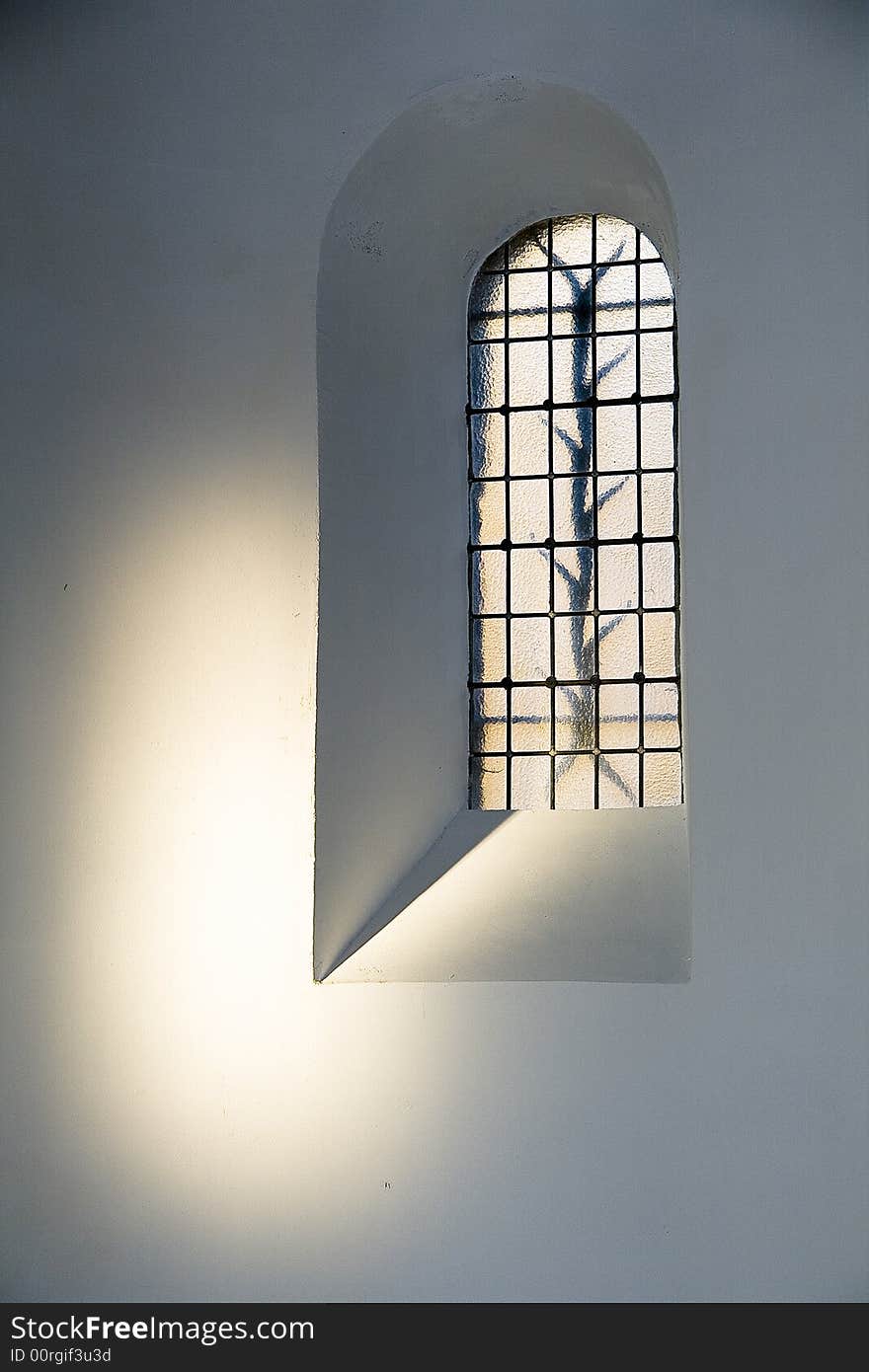 Image taken in a castle in the Netherlands during sunset. The low sunlight is falling through another window next to the oposite window. Image taken in a castle in the Netherlands during sunset. The low sunlight is falling through another window next to the oposite window.