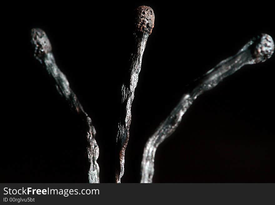 Match with smoke isolated in dark background