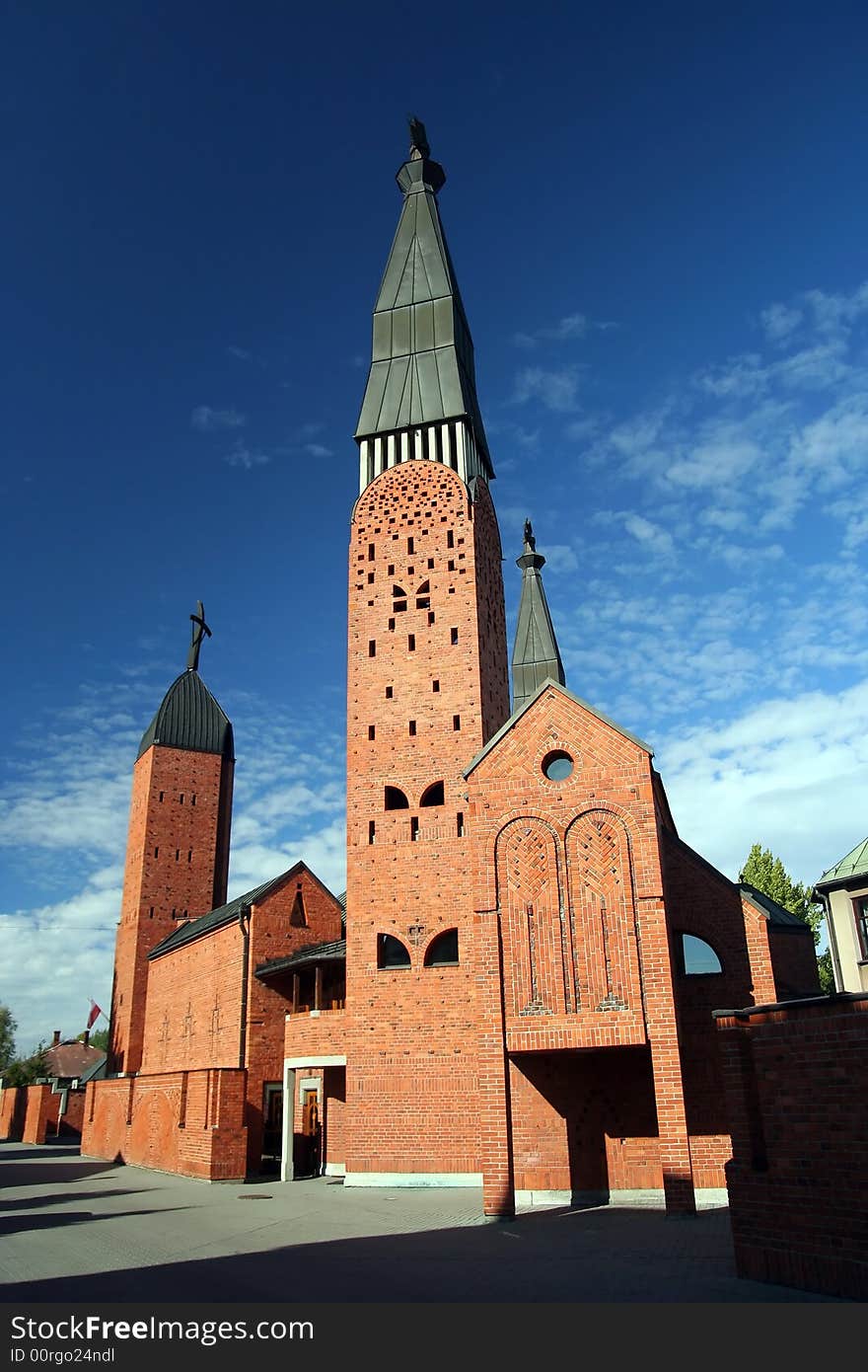 Red church and cirrus sky