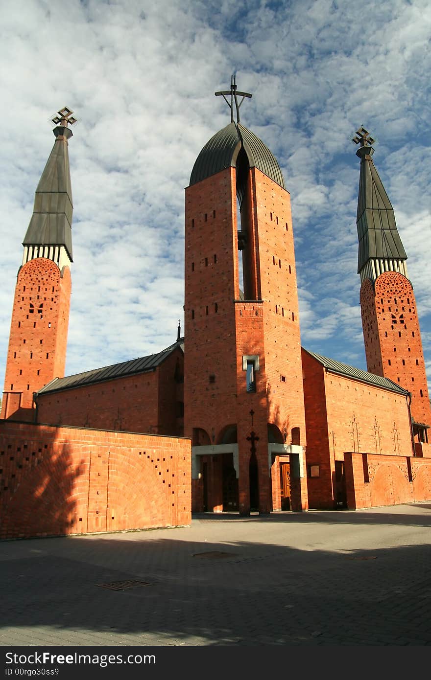 Red church and cirrus sky