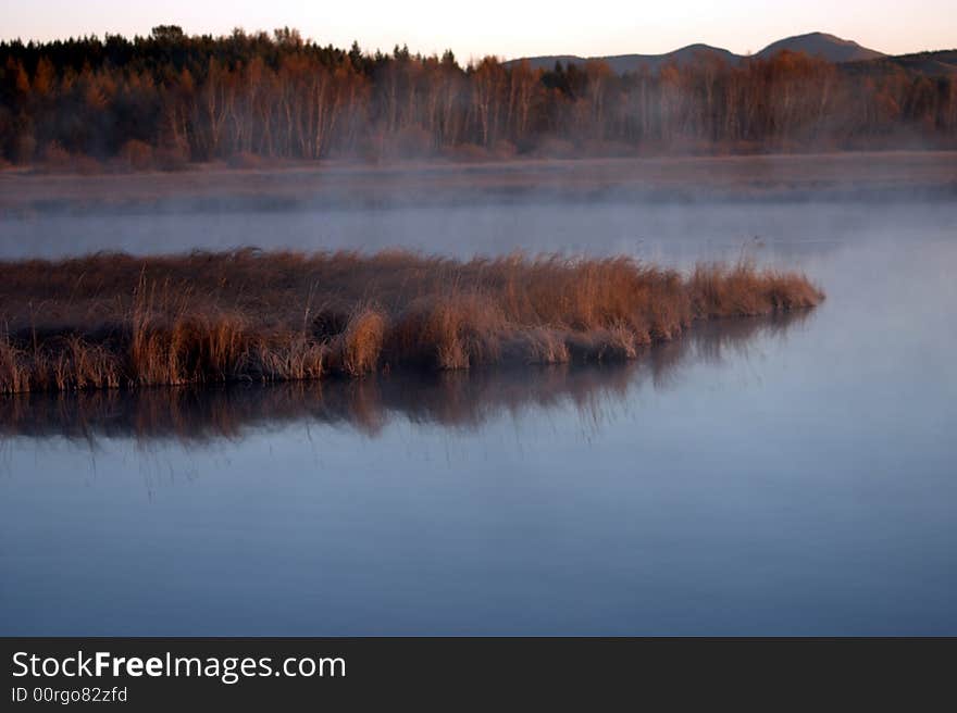 Sunrise by a lake in autumn morning-1