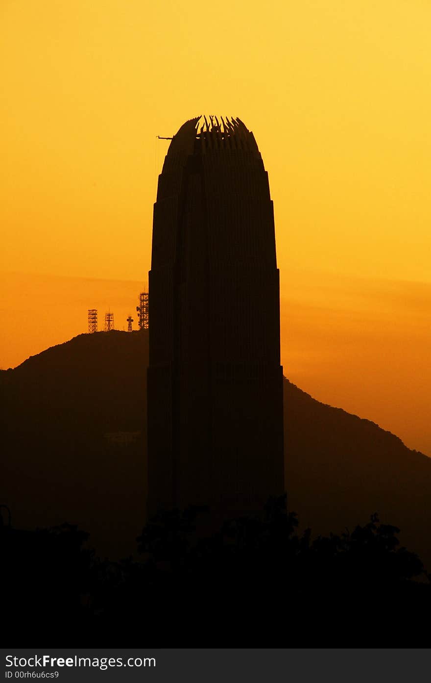 Silhouette of a tall tower that is under construction. Behind are the hills. Can symbolize outstanding results. Silhouette of a tall tower that is under construction. Behind are the hills. Can symbolize outstanding results.