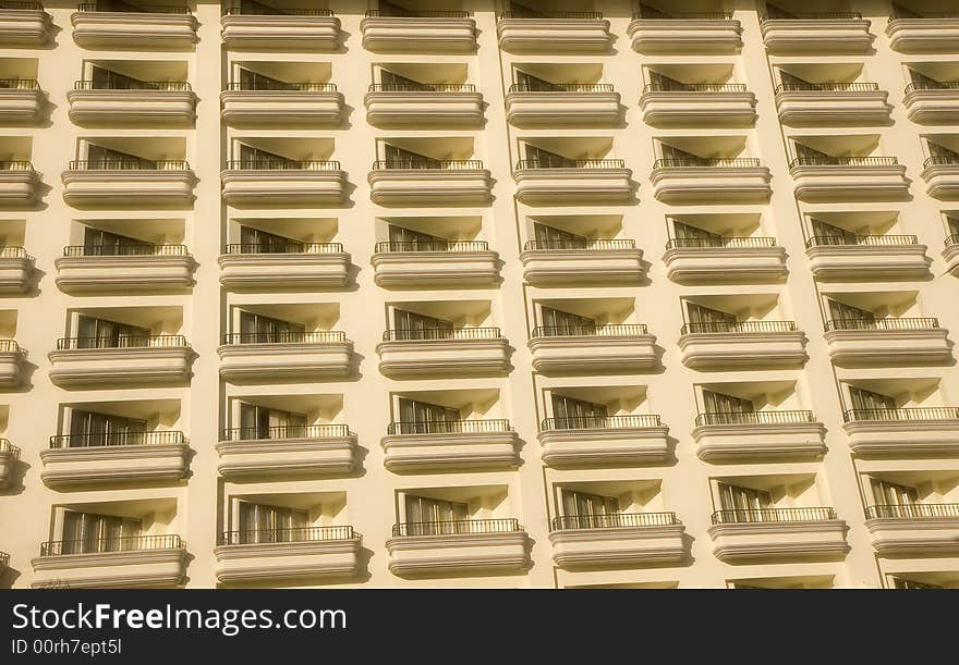 Rows of identical balconies on a white high rise resort hotel. Rows of identical balconies on a white high rise resort hotel