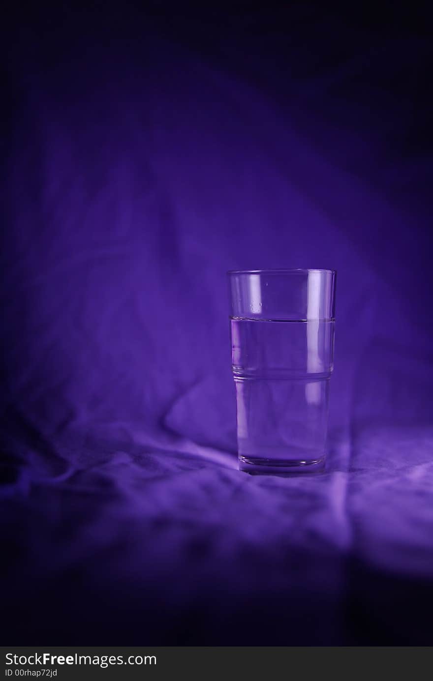 Glass of Water with blue background. Glass of Water with blue background