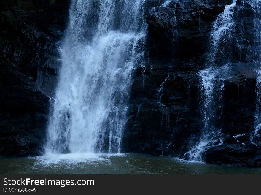 A dark waterfall in the season of winter. A dark waterfall in the season of winter.