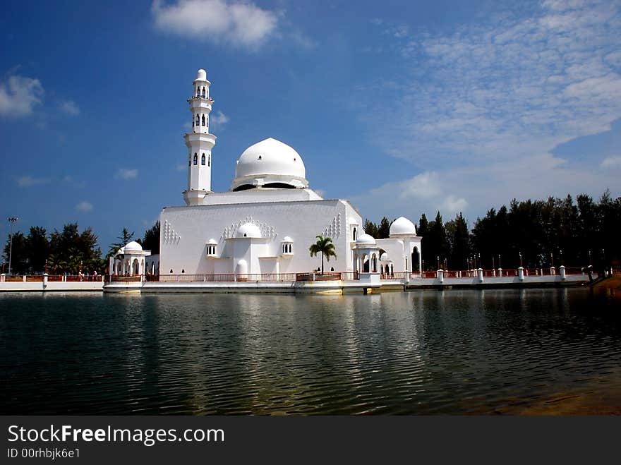 Flouting mosque on the blue sky background