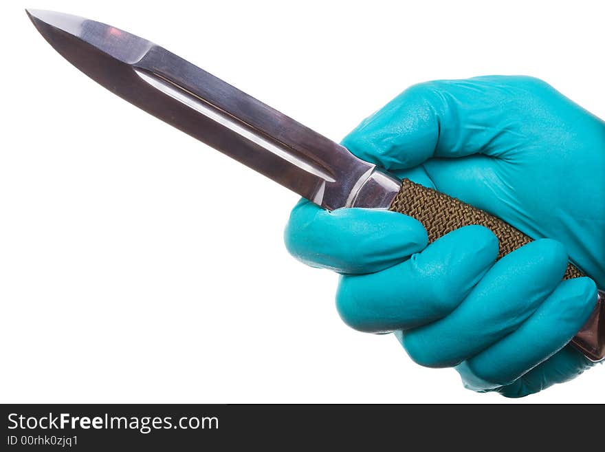 The man's hand in a glove holds knife. Isolated on white [with clipping path]. The man's hand in a glove holds knife. Isolated on white [with clipping path].