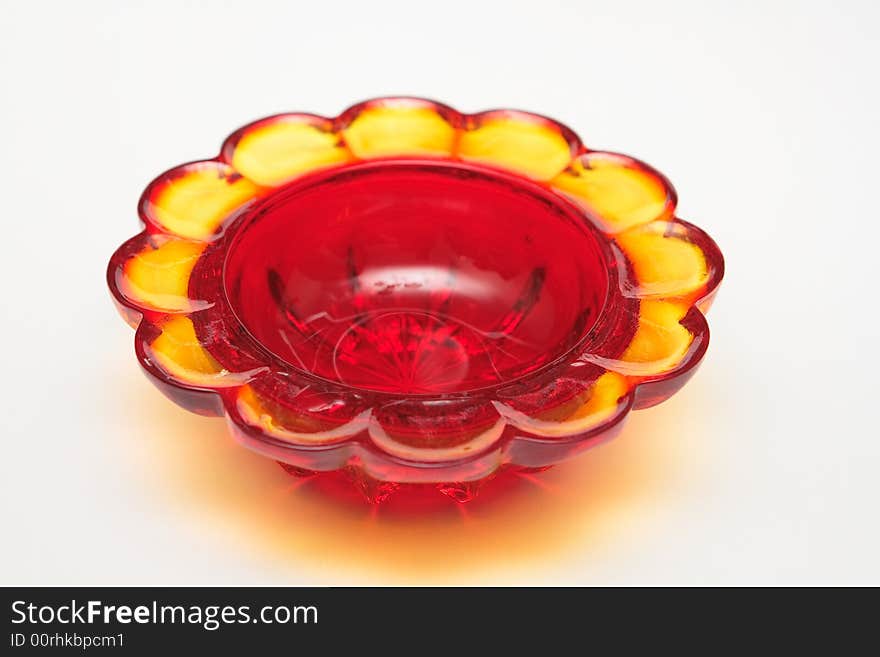 Red glass souvenir on the white background