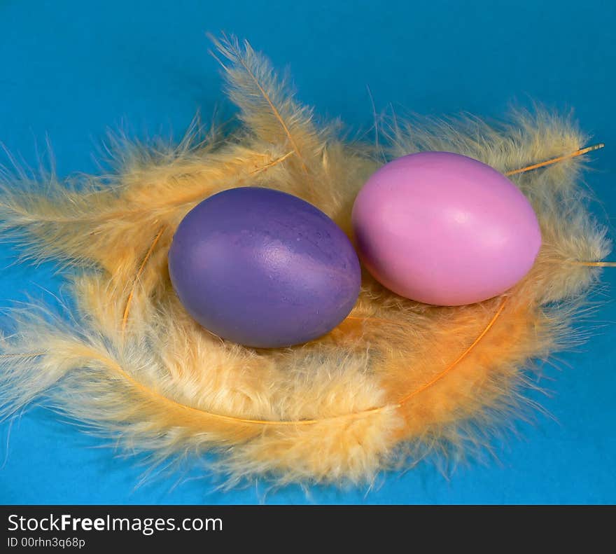 Easter egg with yellow feathers, hand-painted. Easter egg with yellow feathers, hand-painted