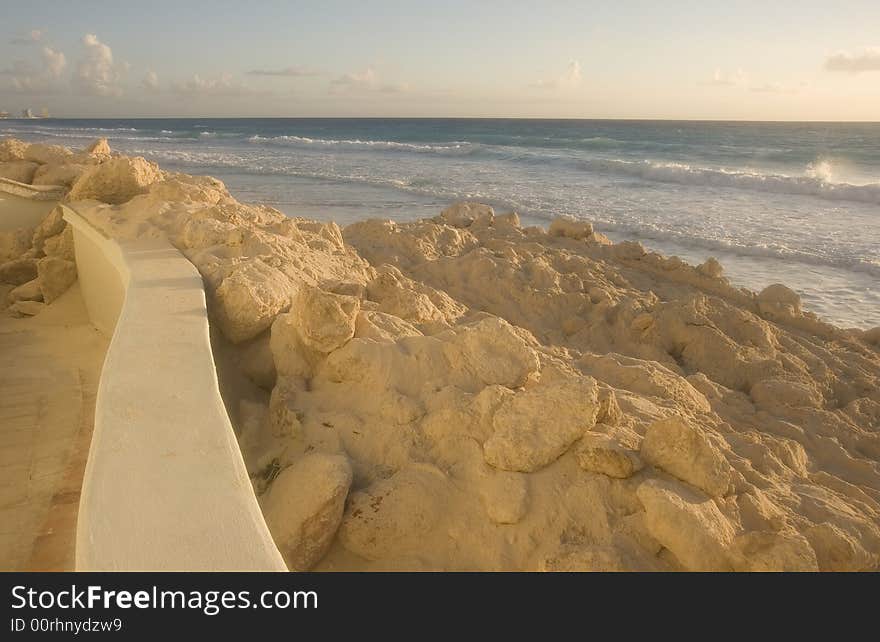 A beach showing erosion and storm damage at dawn. A beach showing erosion and storm damage at dawn