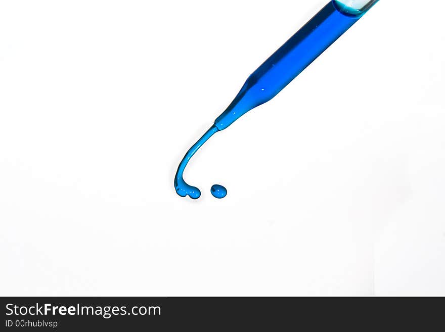 Blue water squirting from eyedropper