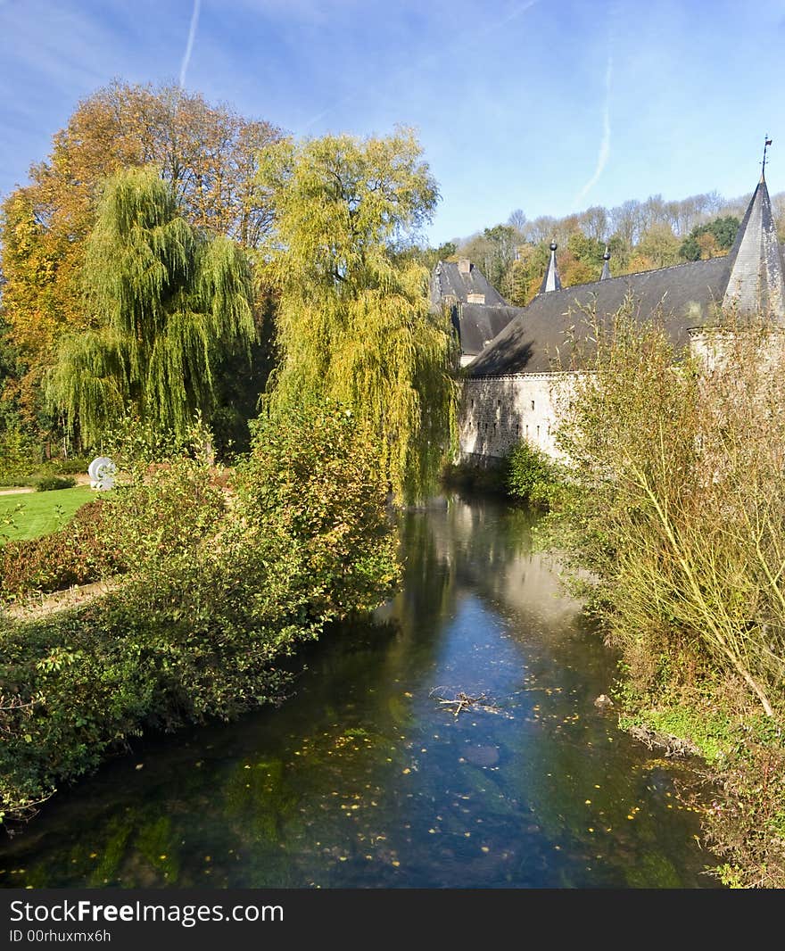 Autumn. A small river in a park. An old construction along the water. Autumn. A small river in a park. An old construction along the water.