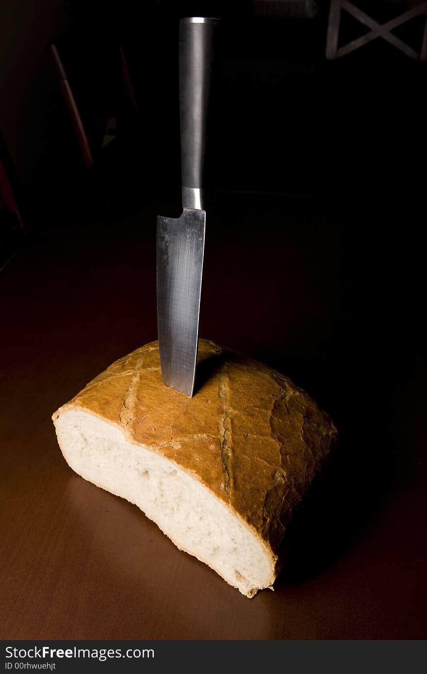 Bread and knife on the table