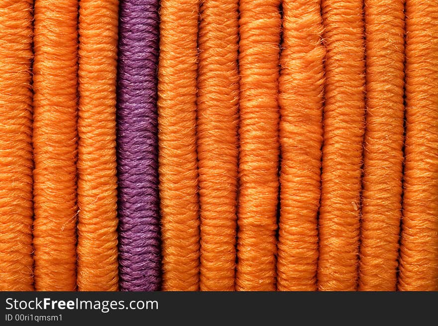 One lilac and many orange vertical straight elastics. One lilac and many orange vertical straight elastics