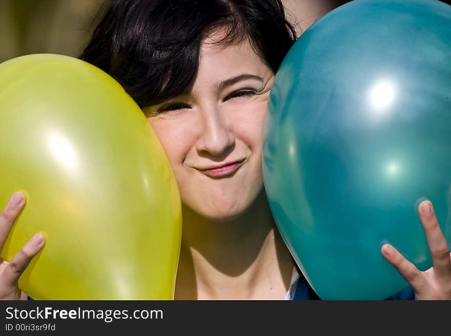 Cute girl between two colored balloons. Cute girl between two colored balloons