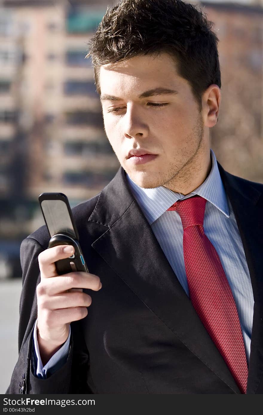 Businessman looking information at his phone. Businessman looking information at his phone