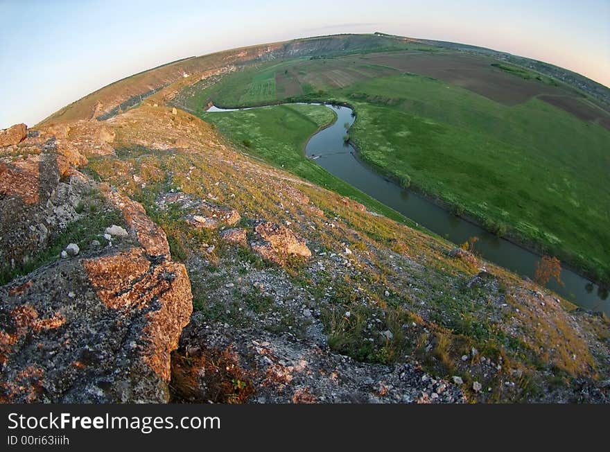 Fishey view of rocky bank of a river