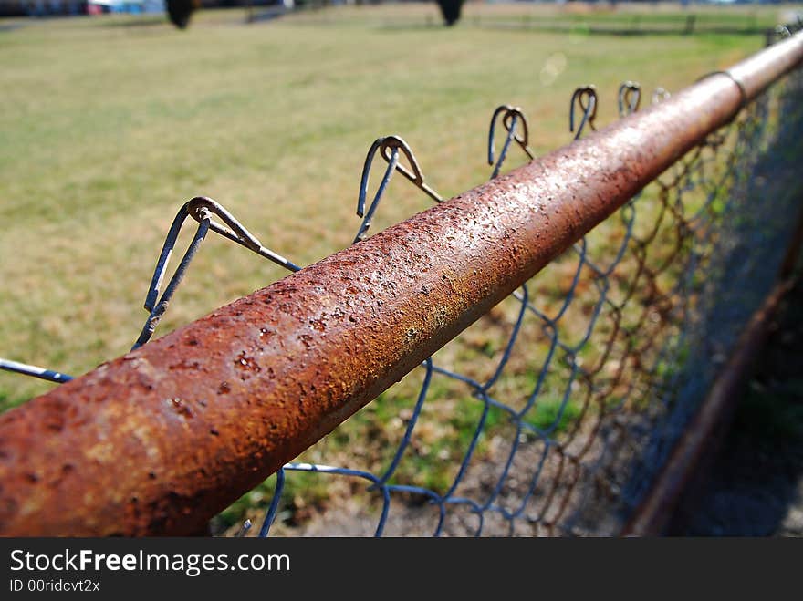 Close up of a chained link fence rail. Close up of a chained link fence rail.