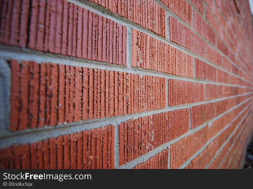 Narrow depth of field of red brick wall. Narrow depth of field of red brick wall.