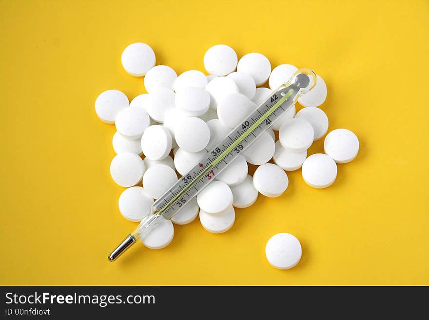 Pills with medicine thermometer .