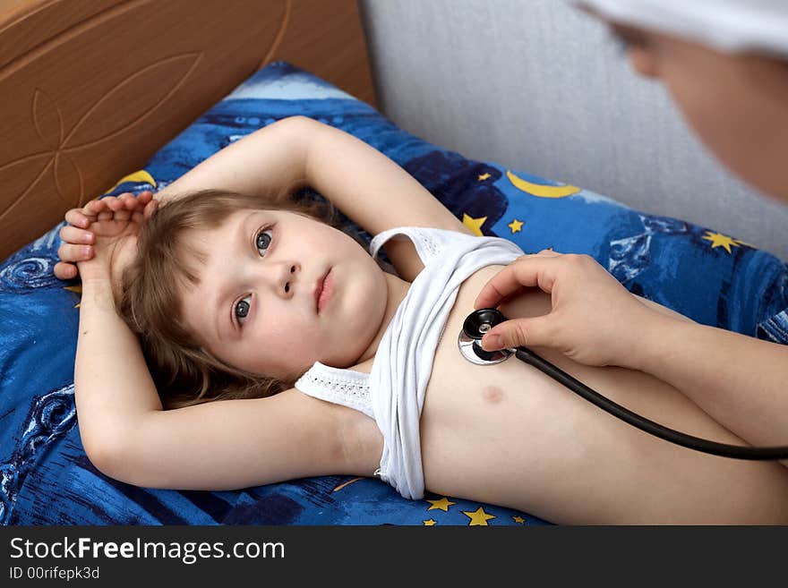 An image of a little girl and a hand with phonendoscope. An image of a little girl and a hand with phonendoscope