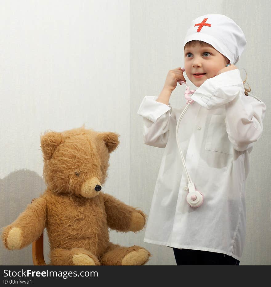 Little girl with toy-phonendoscope playing a doctor. Little girl with toy-phonendoscope playing a doctor