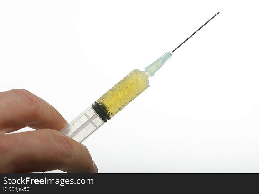 Syringe held by doctor on white background.