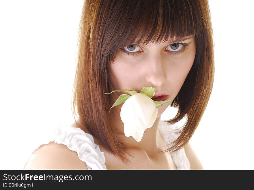 Young pretty woman with white rose in her lips. Young pretty woman with white rose in her lips