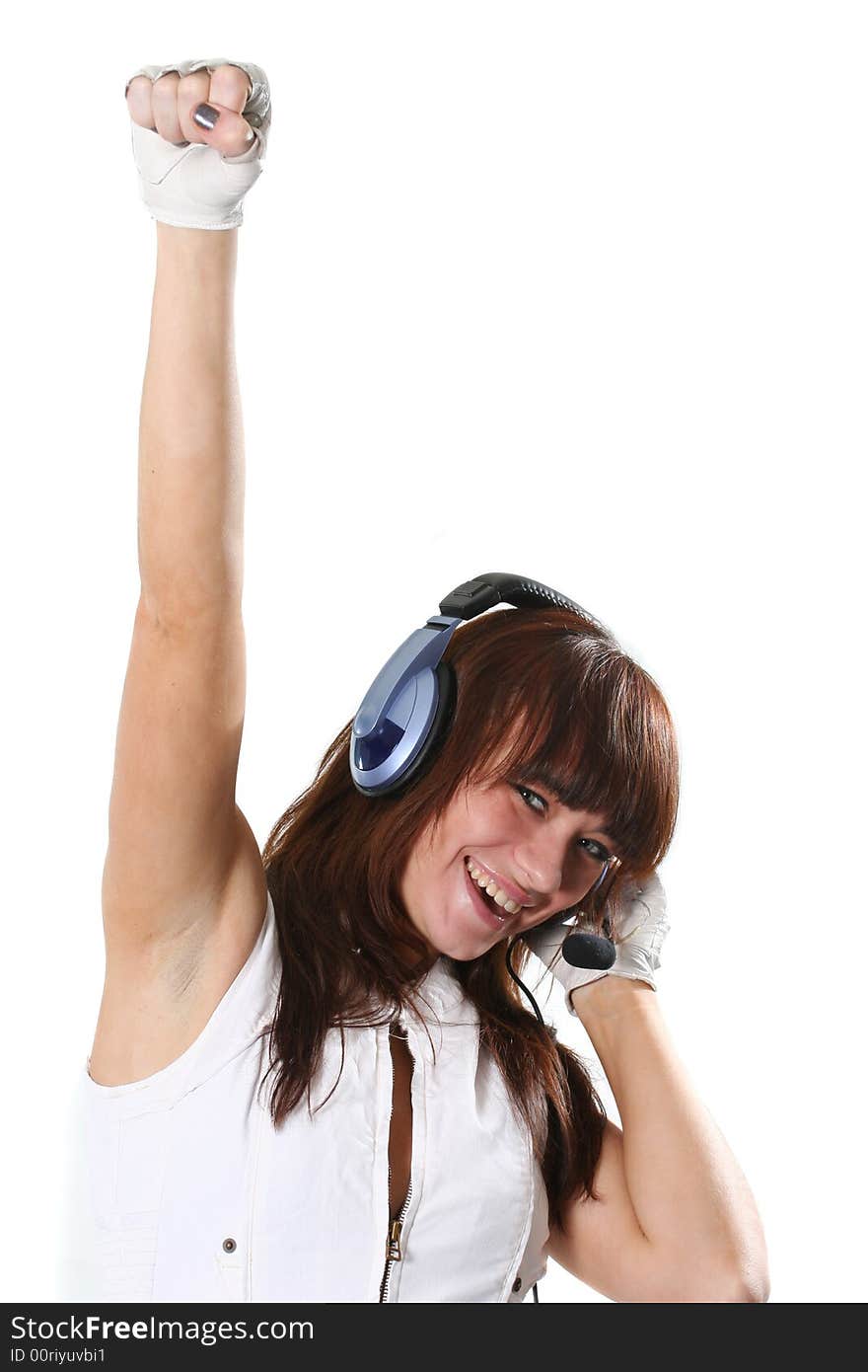 The happy girl listens to music in headphones. The happy girl listens to music in headphones