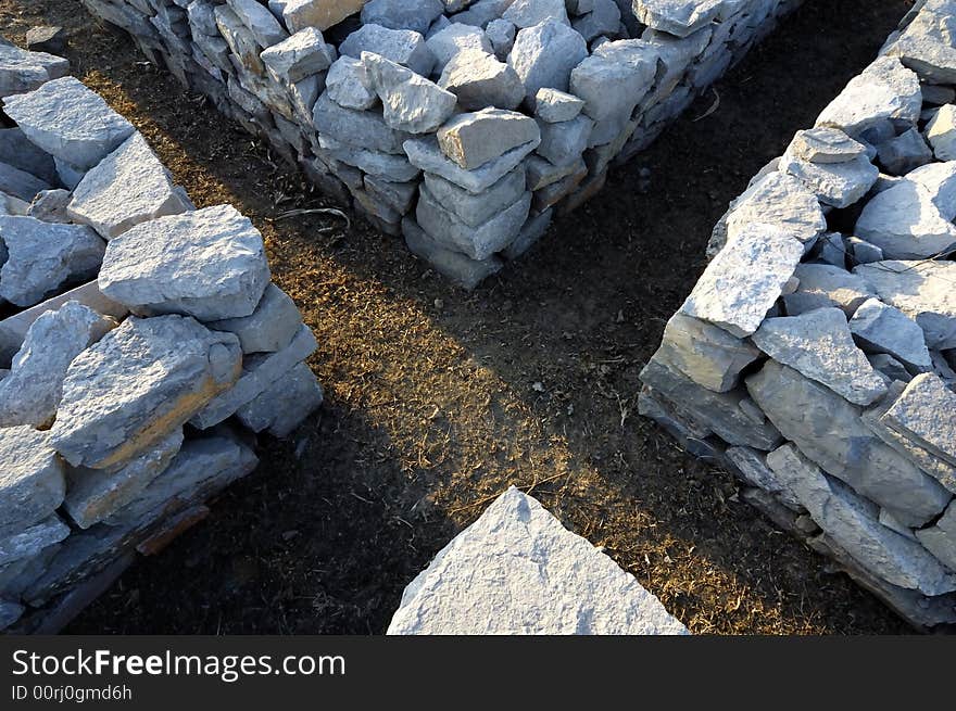 English letter X made by stone pile