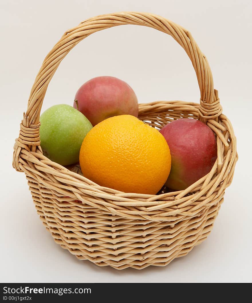 Fresh fruit in basket, isolated