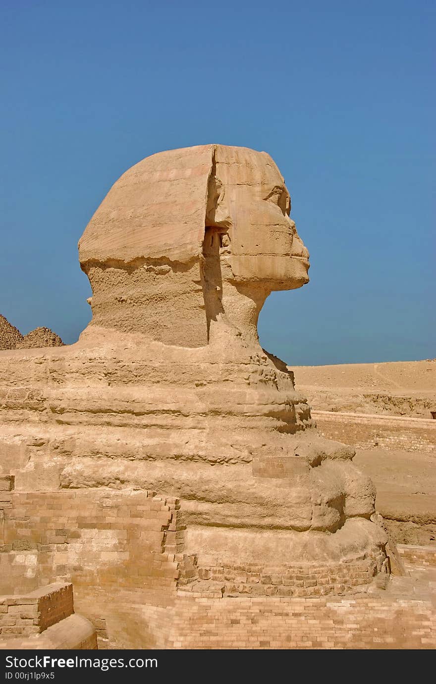 The sphinx half-faced, revealing portion of the body. Giza, Cairo, Egypt.