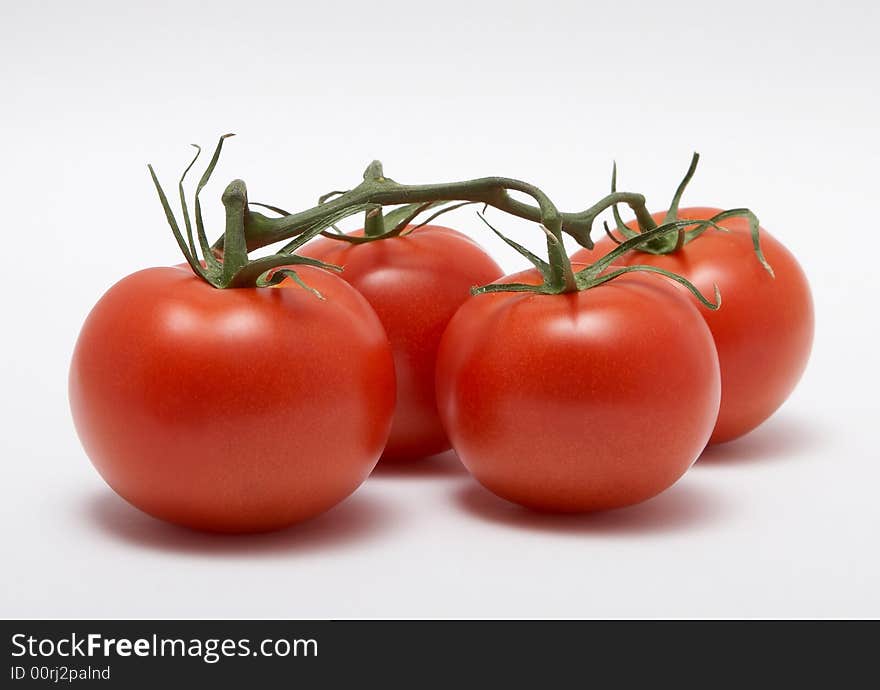 Red tomatoes isolated on white