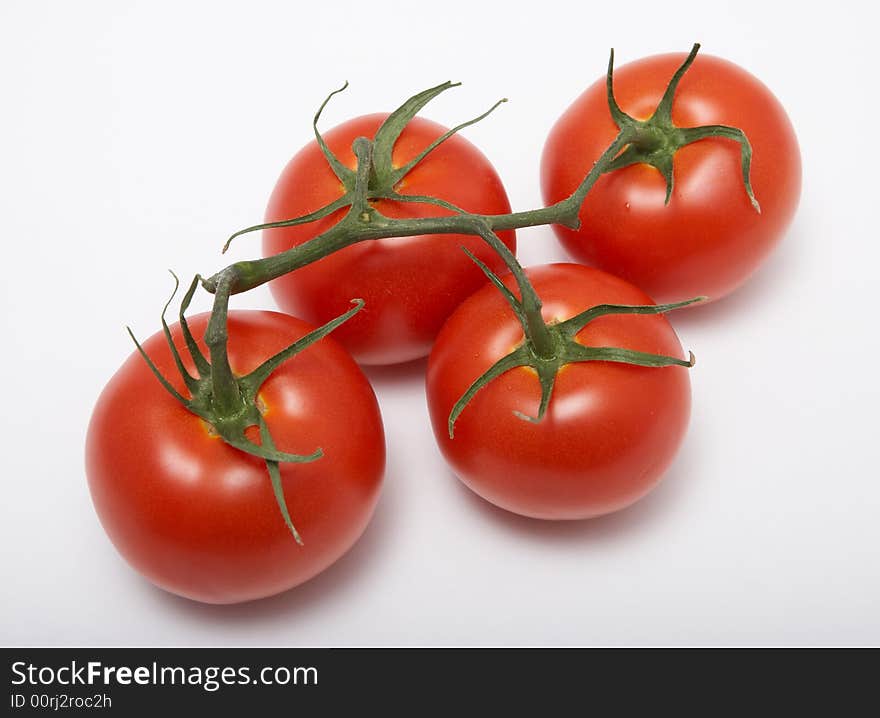 Red tomatoes isolated on white