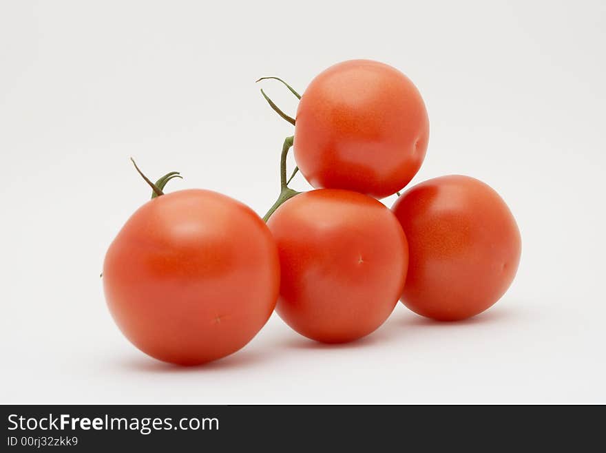 Red tomatoes isolated on white