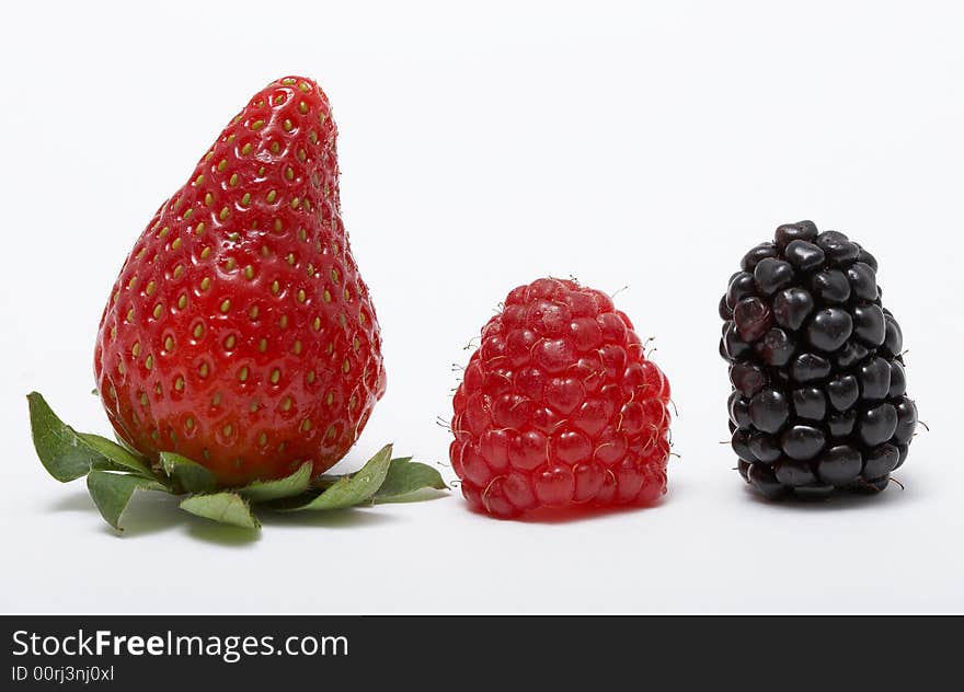 Strawberry, raspberry, and blackberry on white background. Strawberry, raspberry, and blackberry on white background