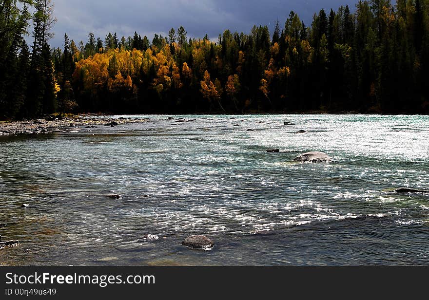 Gree water flickering with argent rays of light in Kanas. Background with yellow and gree leaves of birch trees.
Kanas is Mongolian for The Lake in the Canyon. Gree water flickering with argent rays of light in Kanas. Background with yellow and gree leaves of birch trees.
Kanas is Mongolian for The Lake in the Canyon