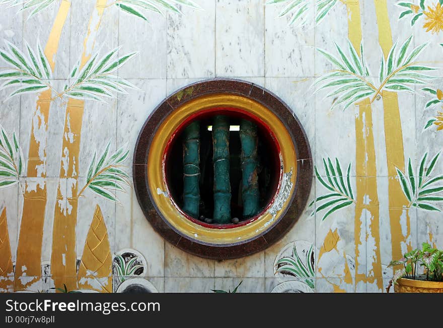 Window at a Chinese temple in Phuket, Thailand.