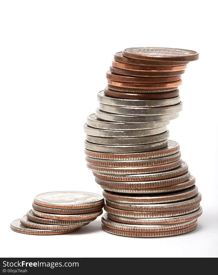 Stack of dollars and coins isolated on white