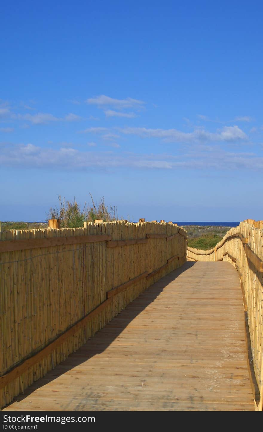 A quiet pathway leads to a beautiful beach. Sardinia beach.